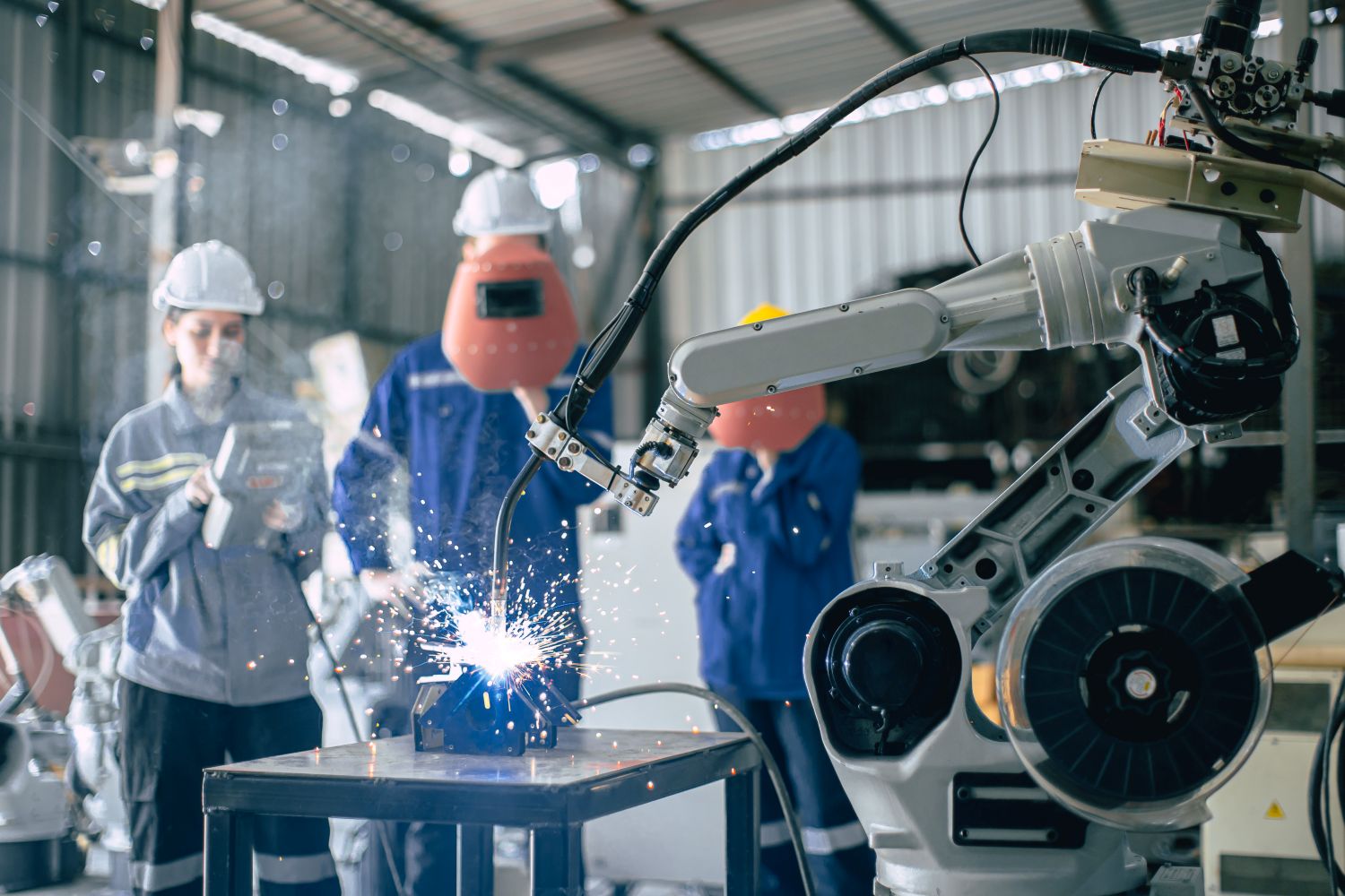 engineer working with welding robot